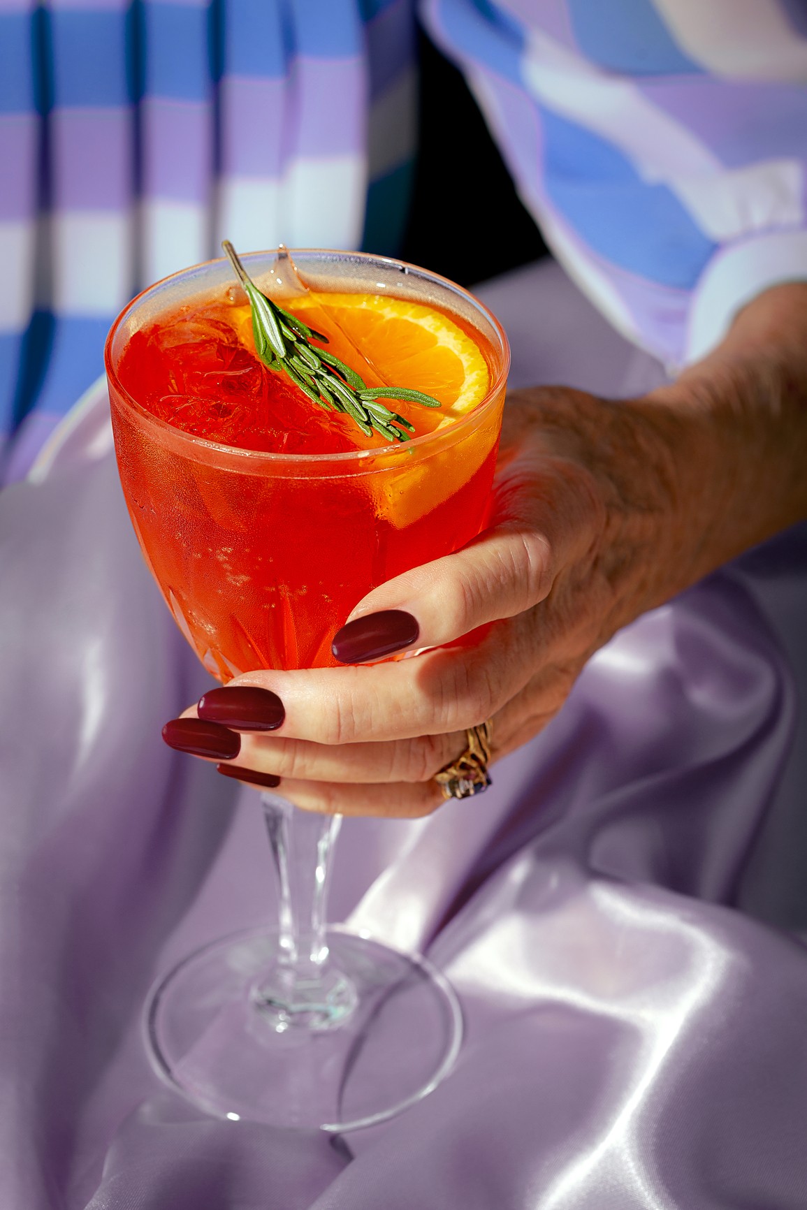 Person sitting on floor working on laptop