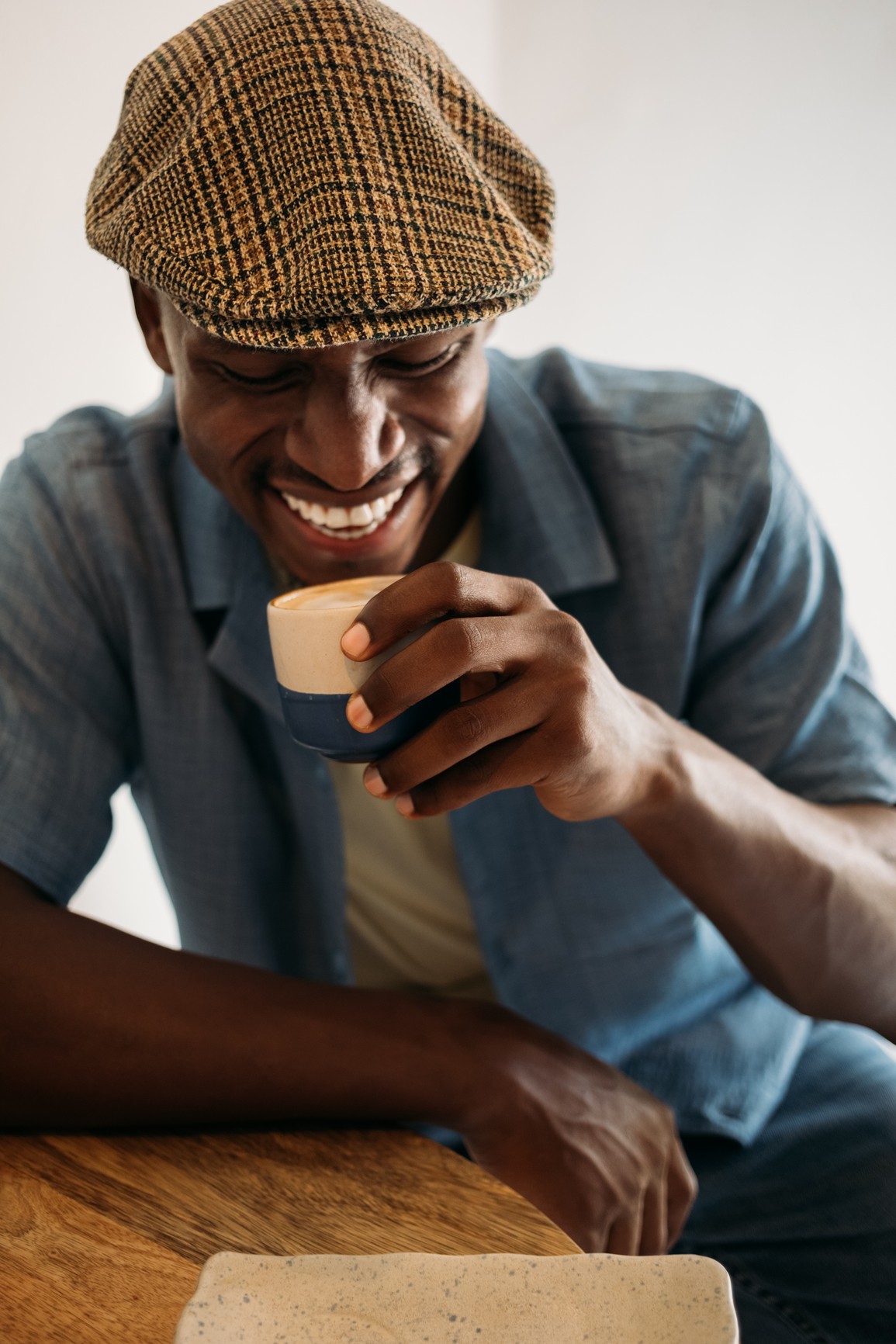 Person sitting by window working on tablet