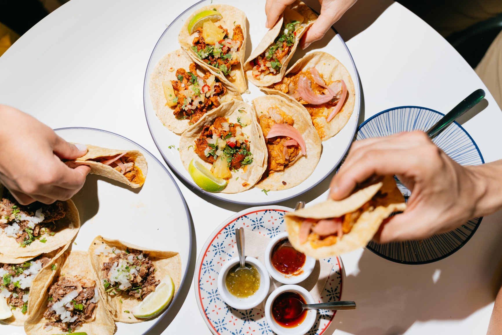 Person sitting on floor working on laptop